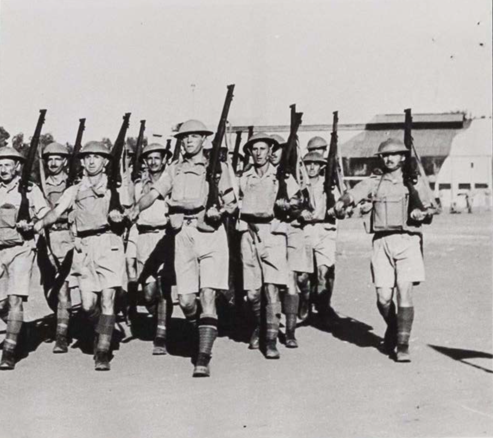 The photo shows Jewish soldiers of the Palestine Regiment marching during training exercises in Egypt.